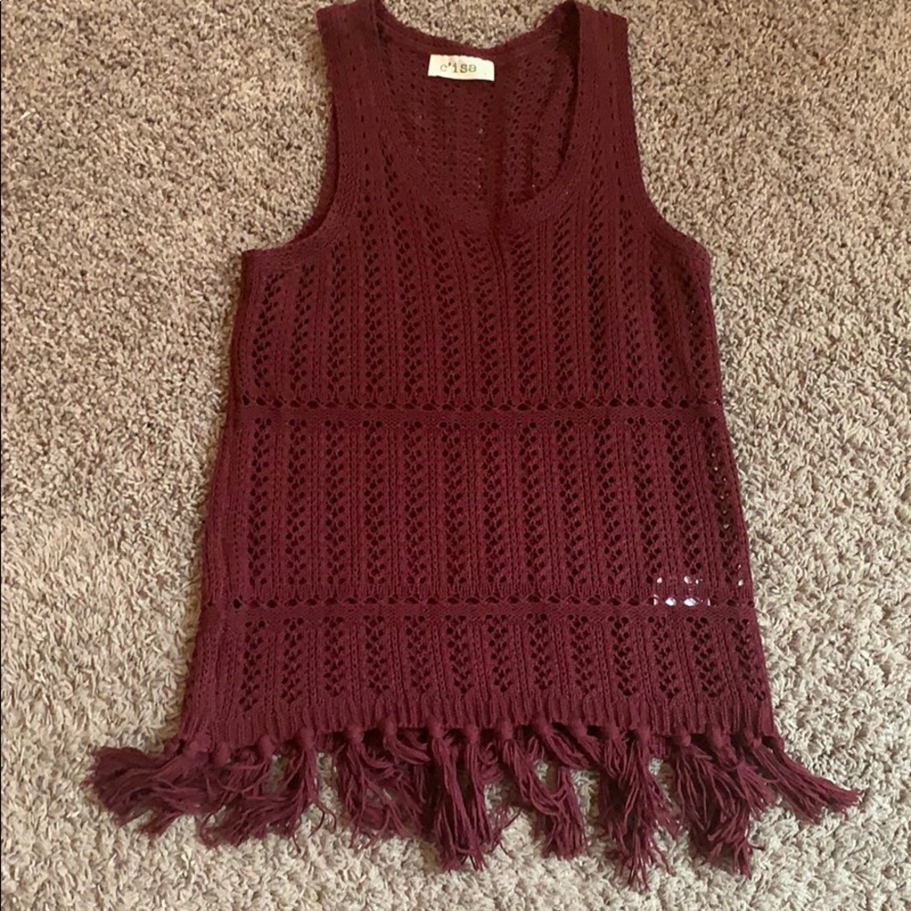 Dressy maroon  sleeveless mesh top.